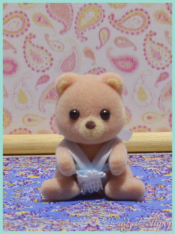 Sylvanian Families Petite Bear baby sitting in carry case