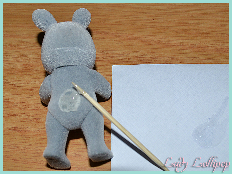 Sticking a new tail onto a damaged Sylvanian Families rabbit figure