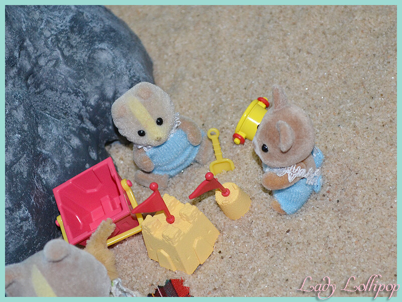 Sylvanian Families babies playing on the beach sand in the diorama