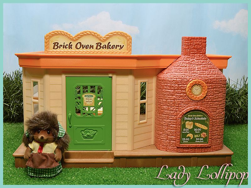 Eleanor Bramble hedgehog mother with the Brick Oven Bakery building