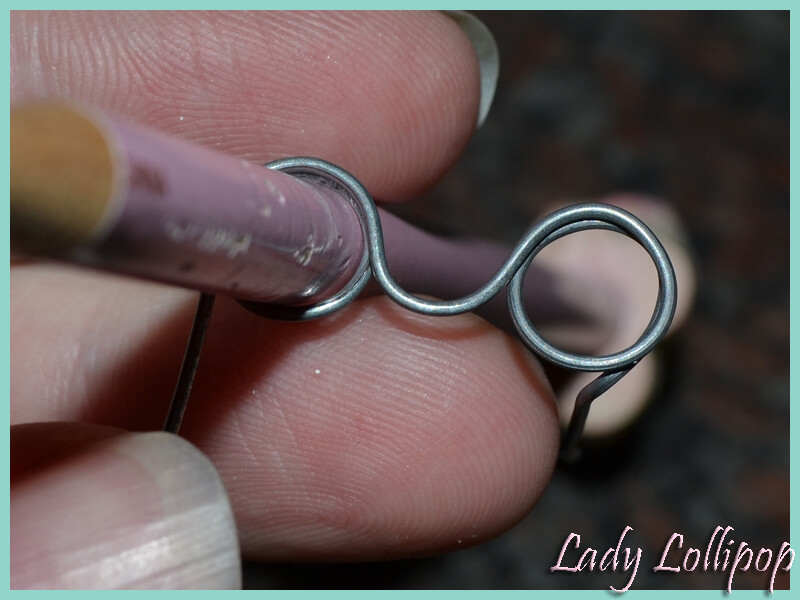 Final step in bending wire to form Sylvanian Families eyeware